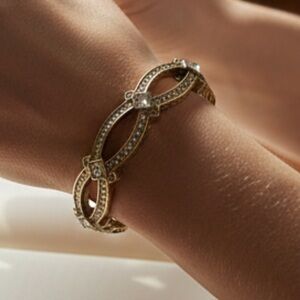 Tantalizing" Heidi Daus Crystal 
 Gold Tone Hinged Bangle Bracelet